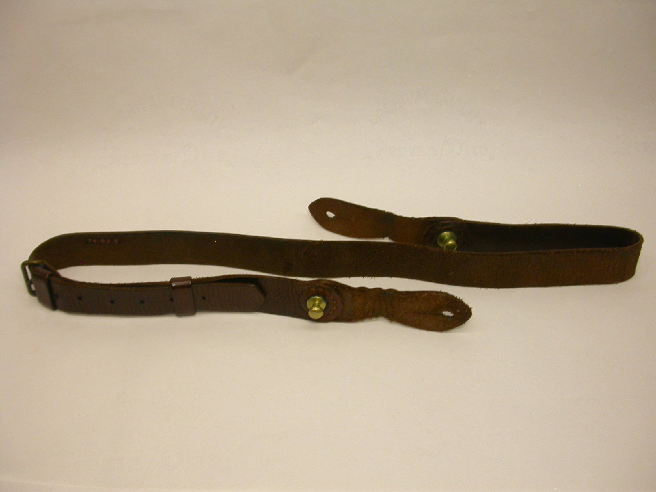 a%20leather%20Sam%20Brown%20belt%20with%20brass%20buckles